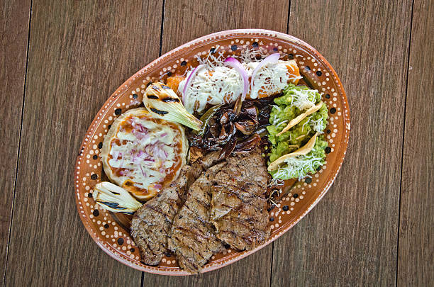 Traditional Cecina Platter with Enchiladas, Guacamole, and a Sope
