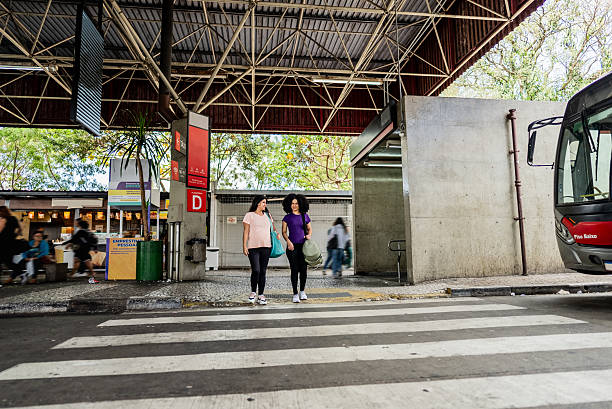 Friends talking while walking in a bus station