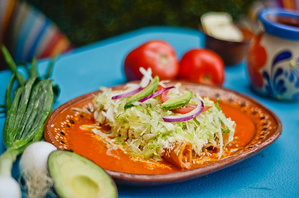 Authentic Mexican Red Enchiladas (Enchiladas Rojas) with Avocado and Cheese