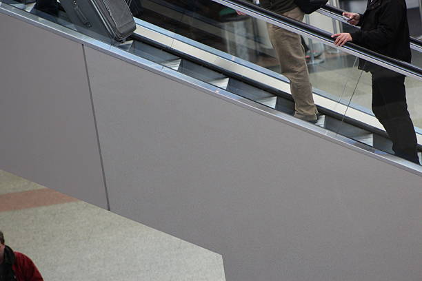 Germany, Berlin, Berlin Hauptbahnhof, February 20, 2025 - High angle view of people on a escalator