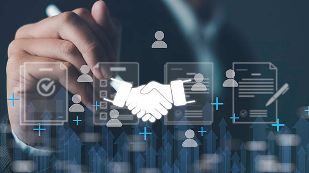 istock Business partnership agreement concept with handshake icon and digital contract documents, symbolizing trust, collaboration, teamwork, deal making, corporate success, and strategic cooperation. 2238653037