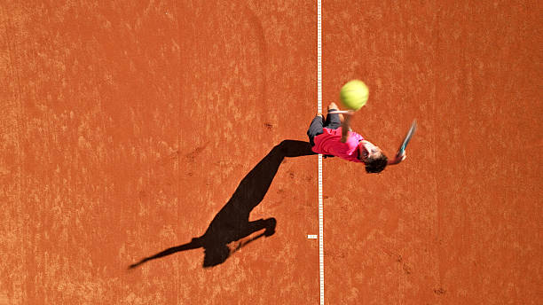 istock Young Tennis Player Practices Swing on Clay Court 2238654044