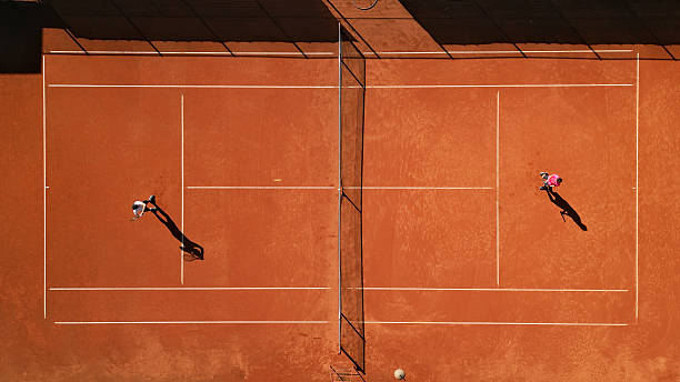 istock Two Athletes Practicing on Clay Tennis Court 2238654068