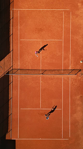 istock Tennis Players Practicing on Clay Court 2238654072