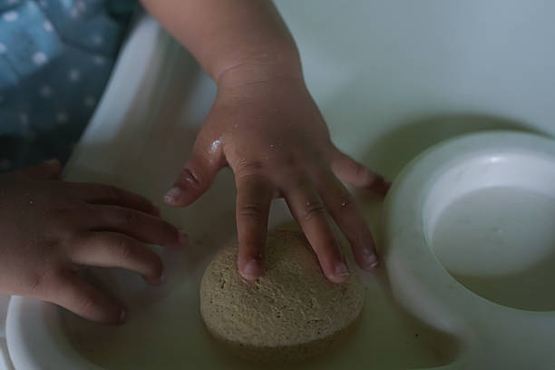 istock Baby Eating Biscuit Close Up 2238658170