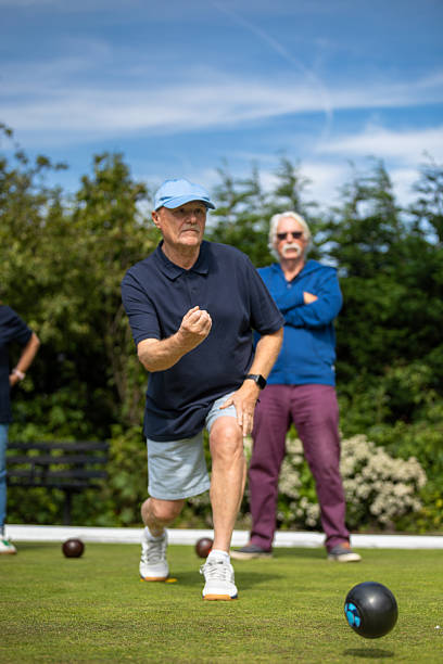 istock Vertical Shot of Two Senior Men Lawn Bowling 2238658377