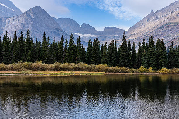 istock Reflections of Forest and Glacier Peaks, Glacier National Park 2238665196