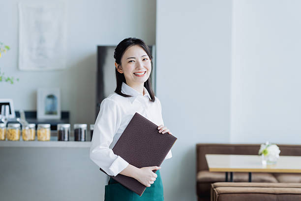 istock Young woman working in a cafe 2238667485
