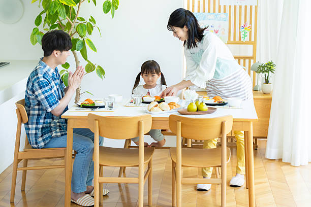 istock family eating at the dining room 2238668188