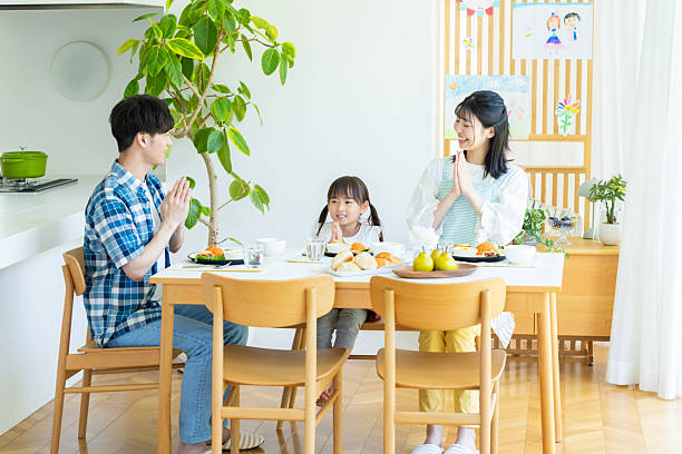 istock family eating at the dining room 2238668210