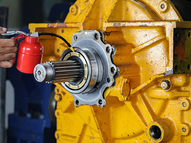 istock Male hand lubricating bearings with oil can. 2238671462