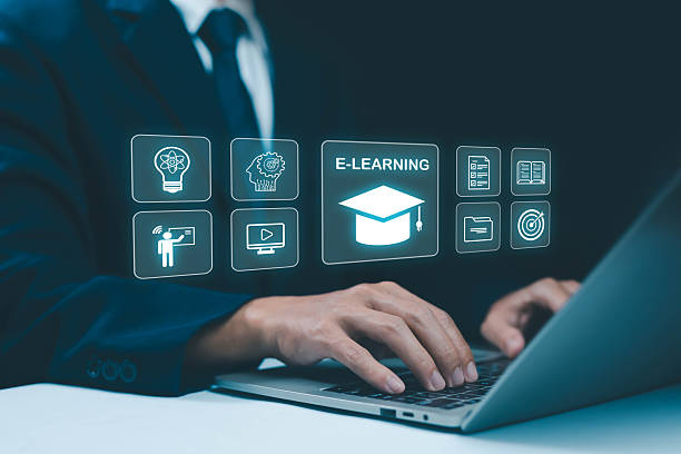 istock Businessman using laptop with virtual e-learning icons, online education concept, digital training, remote learning, and technology innovation for modern study, knowledge, and professional development. 2238671805