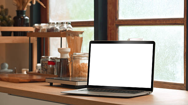 istock Blank laptop screen for mockup on countertop with healthy ingredients 2238672711