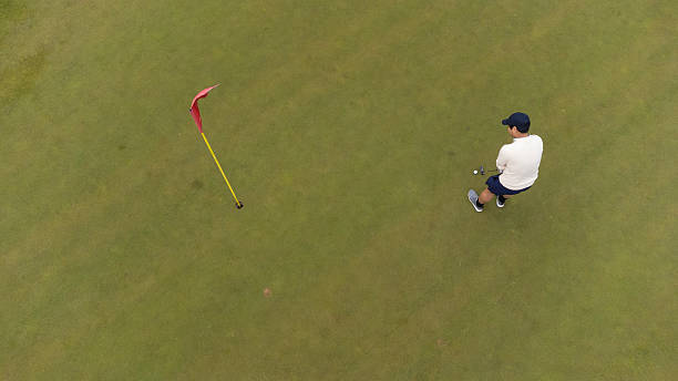 istock Aerial view of a man putting playing golf 2238673393