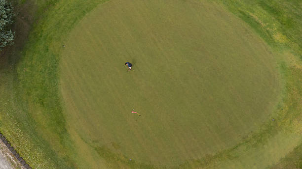 istock Aerial view of a man putting playing golf 2238673401