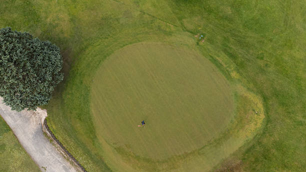 istock Aerial view of a man putting playing golf 2238673411