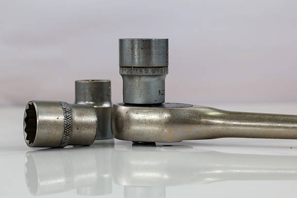 istock industrial tools including a ratchet wrench and several sockets 2238673445