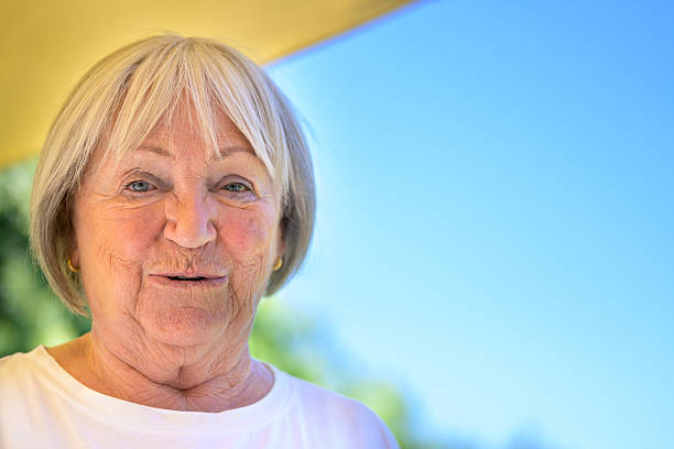 Portrait of active senior female field hockey player