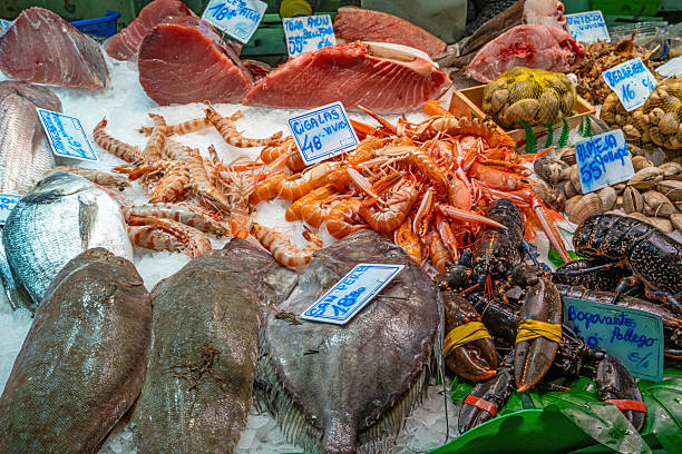 istock Fish monger with fresh fish and seafood 2238677247