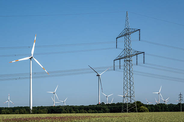 istock Overhead power lines and wind turbines 2238677274
