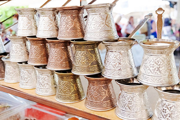 istock Row of silver and gold cups with designs on them 2238680980