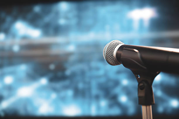 istock Microphone Public speaking background, Close up microphone on stand for speaker speech presentation stage performance or press conference backgrounds. 2238681055