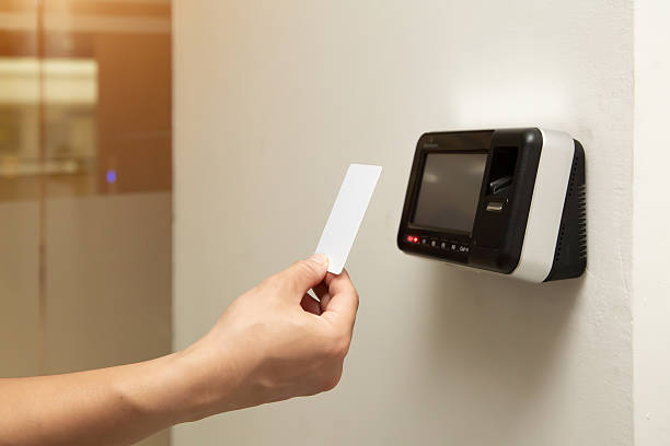 istock Office man using the id card to scan at the access control system machine for check attendance and open the security door. 2238681879