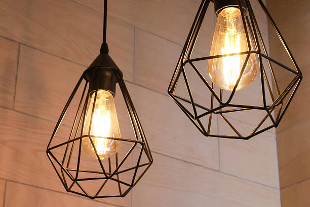 istock Modern geometric pendant lights with exposed Edison bulbs 2238682464