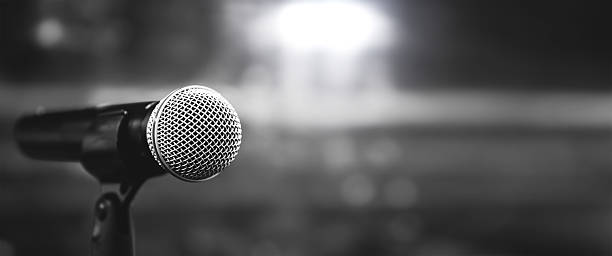 istock Microphones Public speaking background, Close up microphone on stand for speaker speech presentation stage performance or press conference backgrounds. 2238682701
