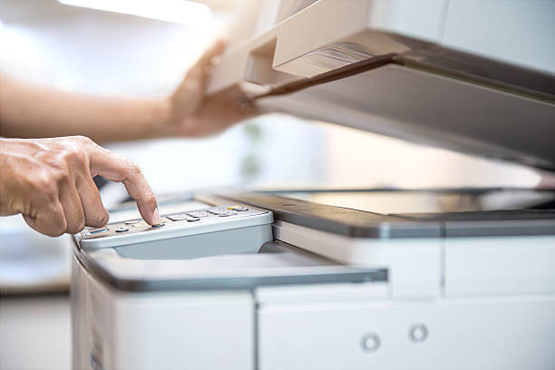 istock Photocopier printer, Close up hand office man press copy button on panel to using the copier or photocopy machine for scanning document or printing paper or Xerox a sheet. 2238683103