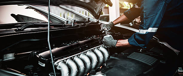 istock Car care maintenance and servicing, Close-up hand technician auto mechanic using the wrench to repairing change spare part car engine problem and car insurance service support. 2238683171