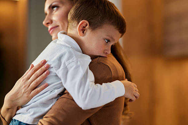 istock Loving mother consoling her sad son at home. 2238685472