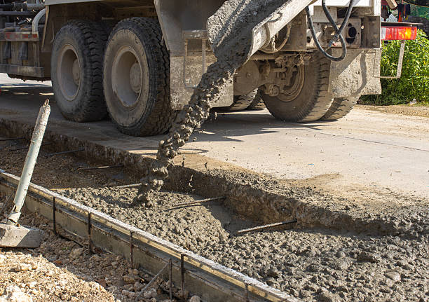 istock construction of a concrete highway, a concrete mixer for pouring concrete 2238685563