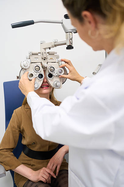 istock Optometrist conducting vision test for patient 2238685661