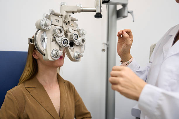 istock Ophthalmologist performing eye exam on female patient 2238685662