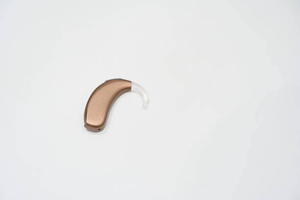 Modern digital hearing aid on a white background, representing advanced medical technology for assisting people with hearing impairment