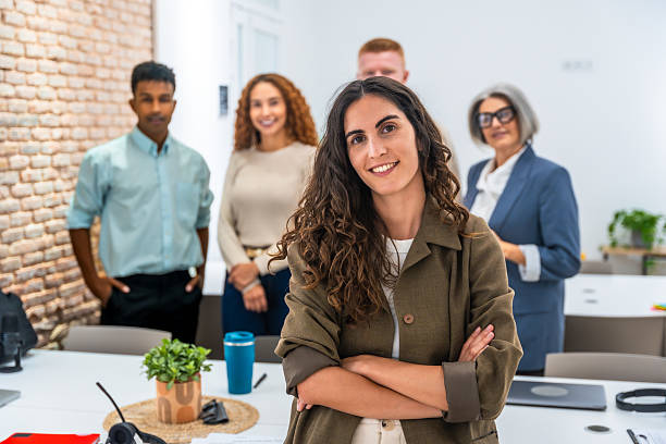 istock Diverse business team standing together in an office 2238690175