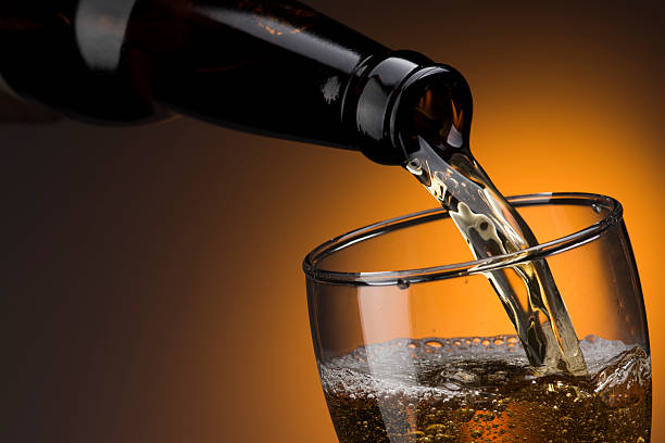 istock Beer Pouring From Bottle To Glass 2238691073