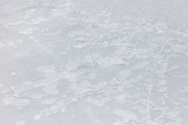 A large, white surface with numerous small, white circles scattered across it. The circles vary in size and are positioned in different areas of the surface, creating a visually interesting