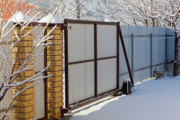istock A gate is open and snow is on the ground 2238691589