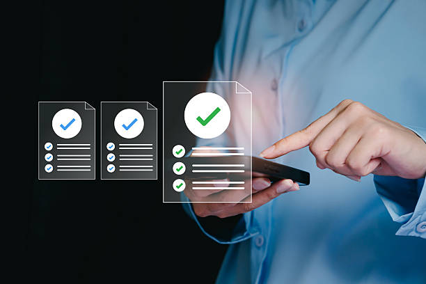 istock Business Professional Reviewing Documents on Smartphone with Digital Check Marks in Modern Office Environment 2238691642
