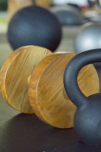 istock Unique Wooden Dumbbell and Kettlebell 2238691709