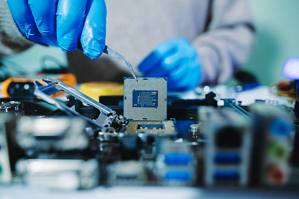 istock The technician is putting the CPU on the socket of the computer motherboard. electronic engineering electronic repair, electronics measuring 2238693398