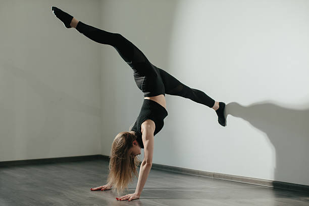 istock Contemporary Dancer in a Splits Position, Showcasing Flexibility and Strength 2238693807