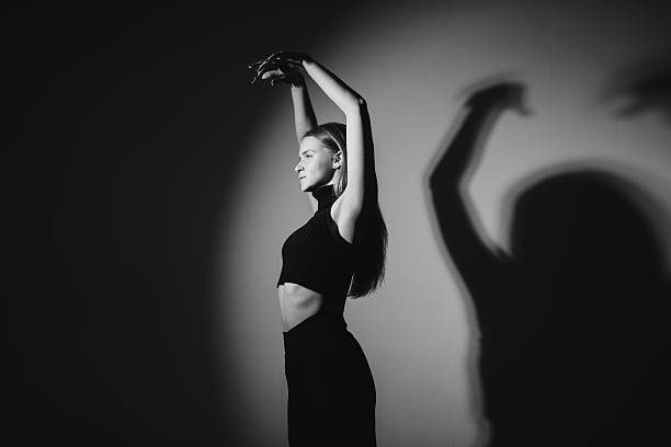 Graceful Contemporary Dancer Posing Elegantly in the Studio. BW photo.