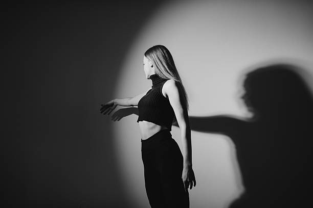 Graceful Contemporary Dancer Posing Elegantly in the Studio. BW photo.