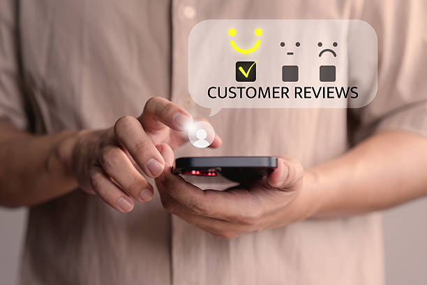 istock Male member using a smartphone select a happy face icon from a feedback. Business concept of customer service satisfaction, review, and positive user experience in an online feedback system. 2238697928