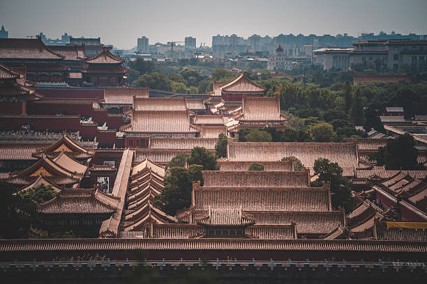 istock Overlooking The Palace Museum in Beijing, this complex of ancient structures exemplifies historic imperial architecture. The intricate rooftops and courtyard arrangements are a stunning sight to observe from above. 2238698197