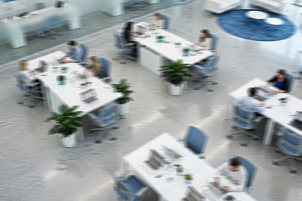 istock Business People Working on Laptops at Desks, Blurred Motion, Top View 2238699011