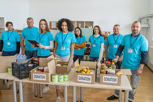 istock Volunteers preparing donation boxes with food and water 2238700100